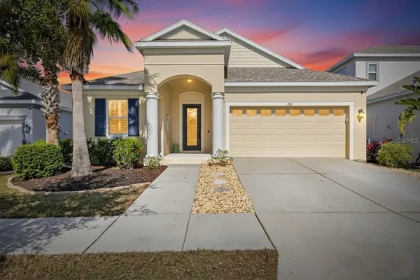 a front view of a house with garden