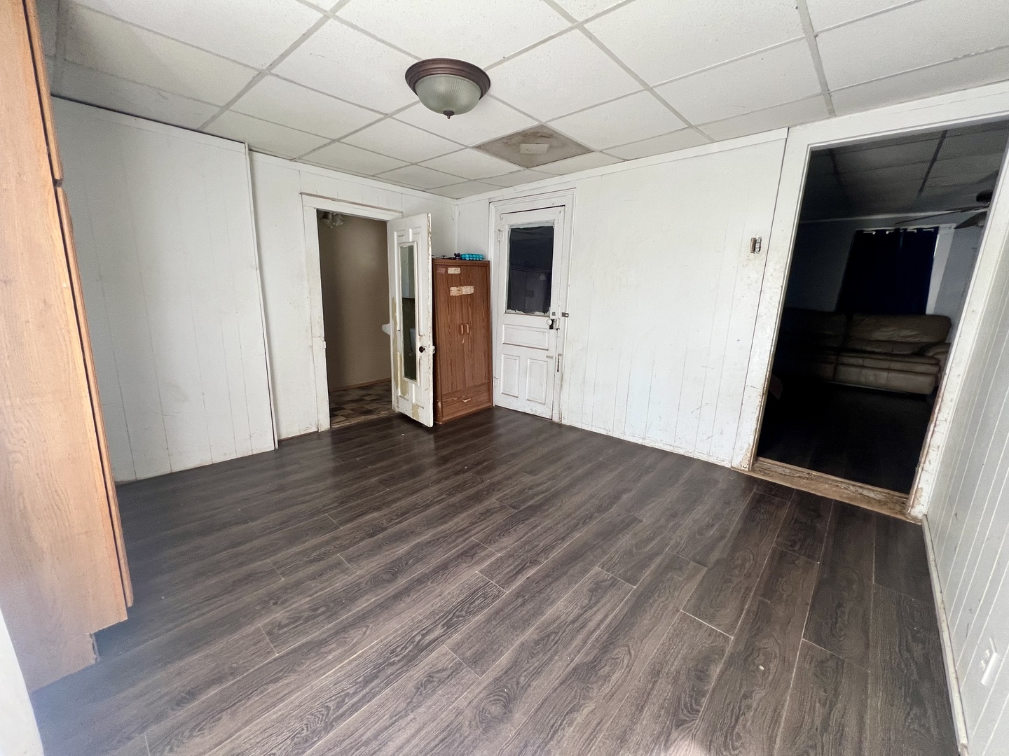 110 South Vermilion Street Potomac, IL 61865 - Photo 15 of 24 an empty room with wooden floor and windows