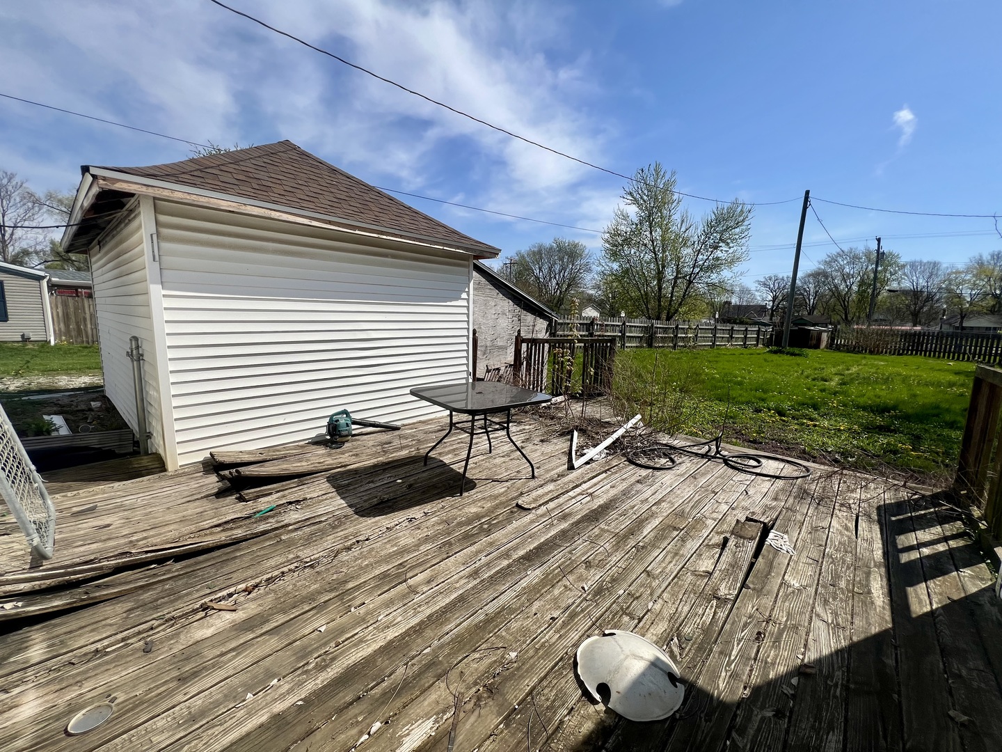 110 South Vermilion Street Potomac, IL 61865 - Photo 21 of 24 a view of a terrace with chairs and potted plants