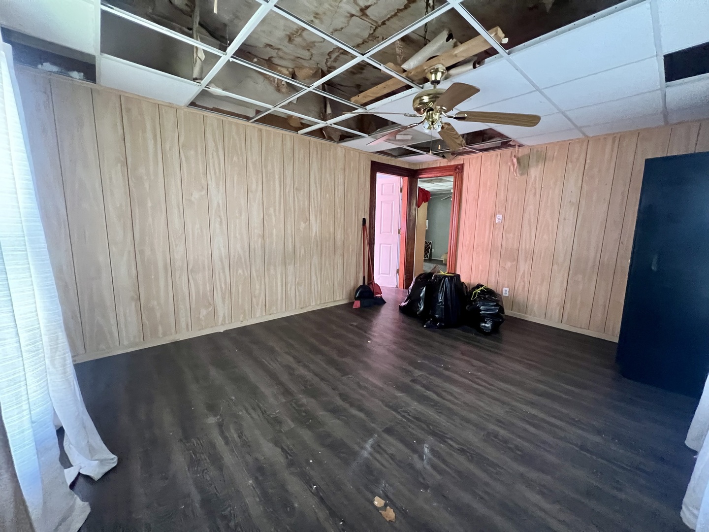 110 South Vermilion Street Potomac, IL 61865 - Photo 6 of 24 a view of a room with wooden floor windows and furniture