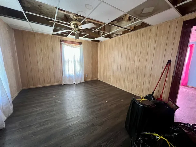 a view of a room with wooden floor