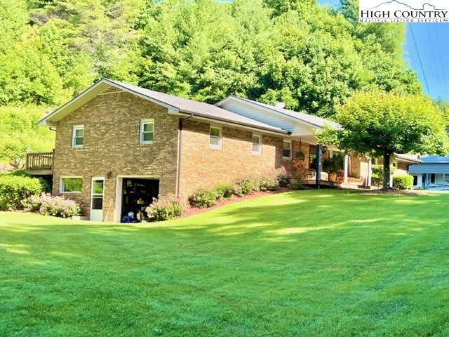 191 Welch Road Lansing, NC 28643 - Photo 1 of 41 a front view of house with yard and green space