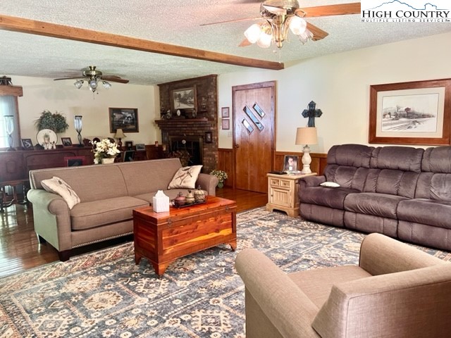 191 Welch Road Lansing, NC 28643 - Photo 11 of 41 a living room with furniture and a chandelier