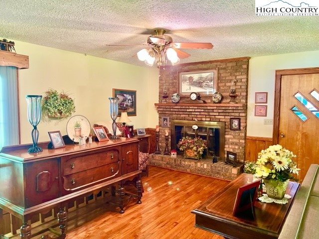 191 Welch Road Lansing, NC 28643 - Photo 12 of 41 a living room with furniture and a fireplace