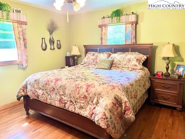 191 Welch Road Lansing, NC 28643 - Photo 16 of 41 a large bed sitting in a bedroom next to a window