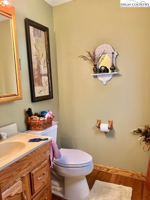 191 Welch Road Lansing, NC 28643 - Photo 18 of 41 a bathroom with a sink mirror and toilet