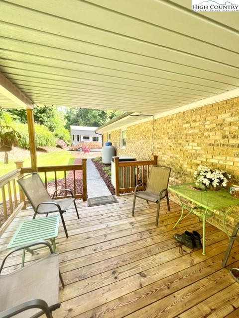 191 Welch Road Lansing, NC 28643 - Photo 28 of 41 a view of a swimming pool with outdoor seating