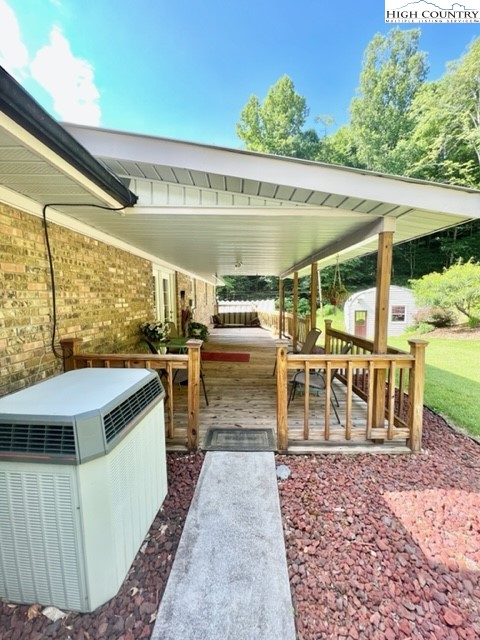 191 Welch Road Lansing, NC 28643 - Photo 35 of 41 a view of a patio with a table chairs and a patio