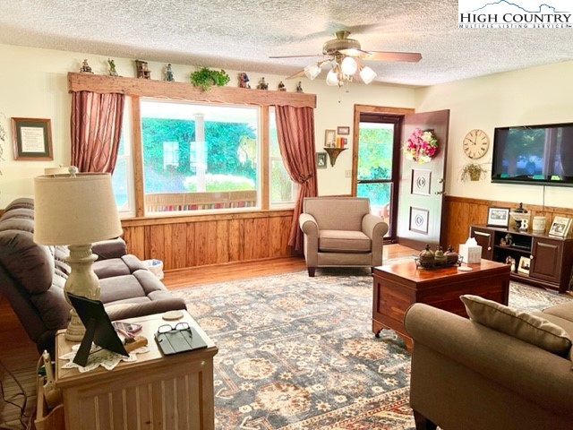 191 Welch Road Lansing, NC 28643 - Photo 10 of 41 a living room with furniture and a flat screen tv