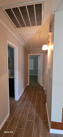a bathroom with a sink vanity and mirror