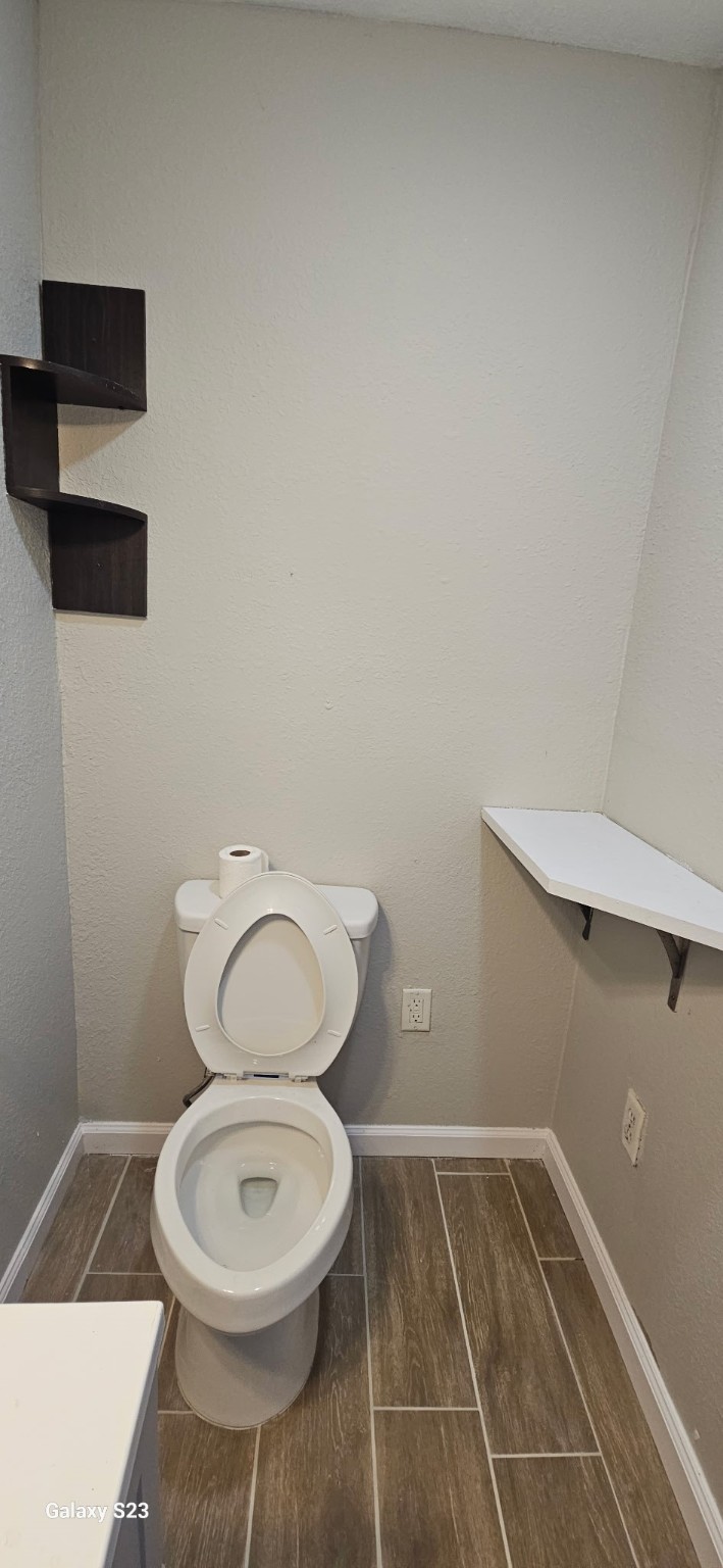 4102 California Avenue Dickinson, TX 77539 - Photo 16 of 19 a bathroom with a toilet and a sink