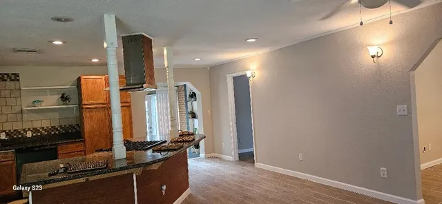 a view of an empty room and a window