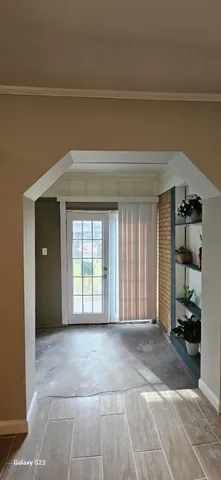 a kitchen with kitchen island a counter top space and a refrigerator
