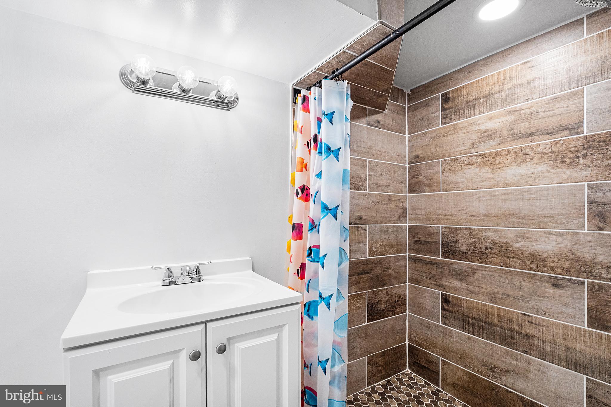1538 Tasker Street Philadelphia, PA 19145 - Photo 11 of 23 a bathroom with a sink and a shower