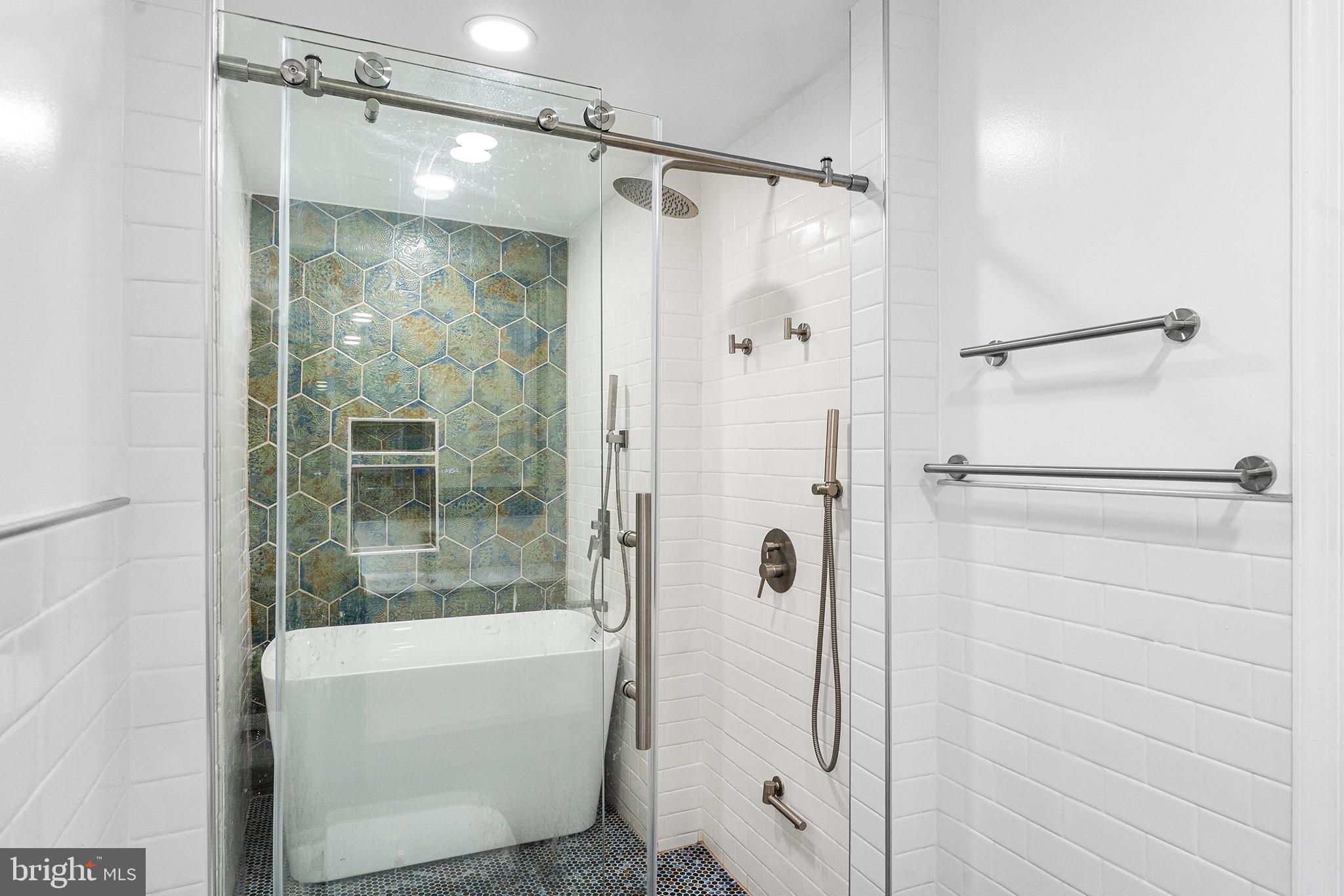 1538 Tasker Street Philadelphia, PA 19145 - Photo 13 of 23 a bathroom with a glass shower door