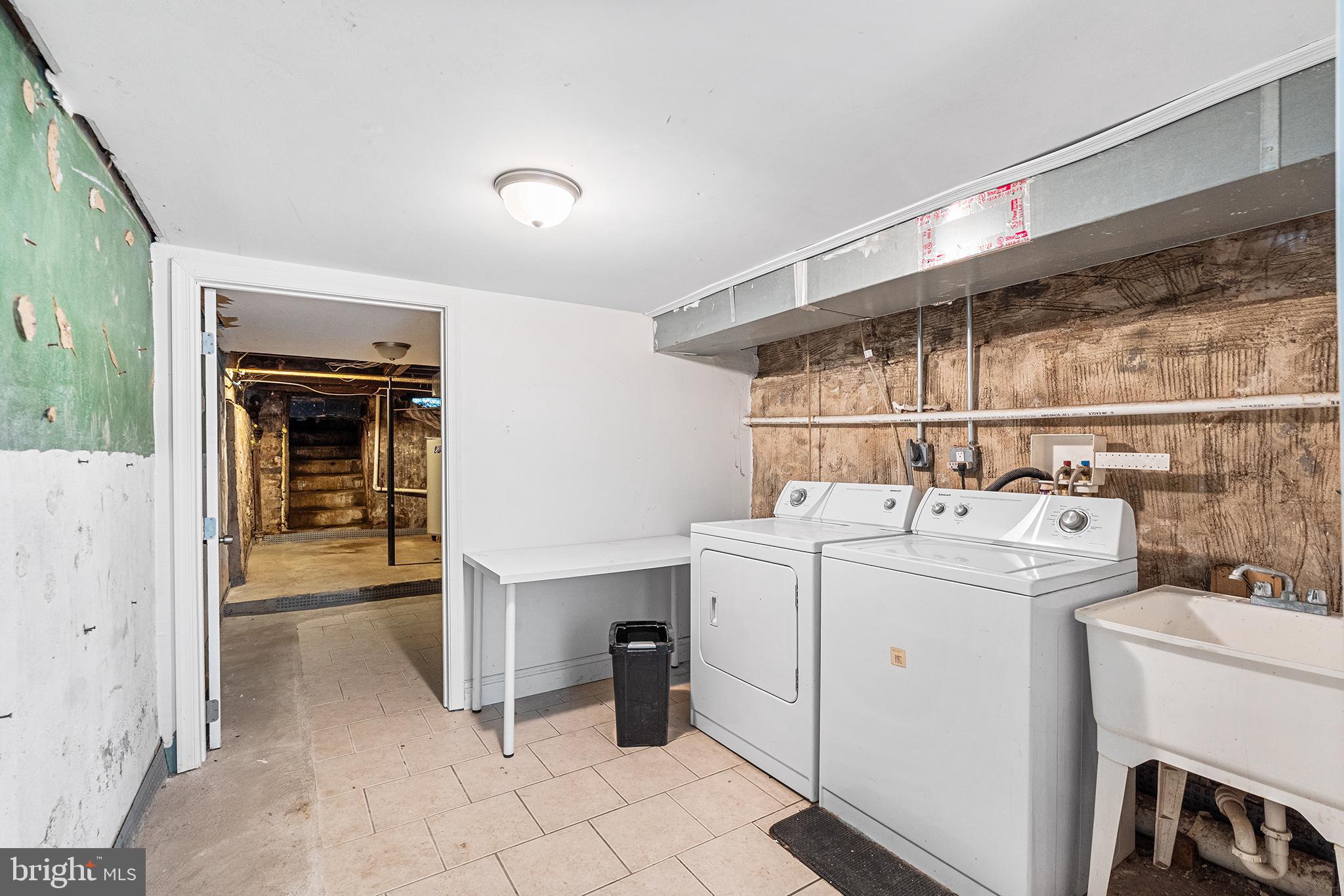 1538 Tasker Street Philadelphia, PA 19145 - Photo 21 of 23 a utility room with dryer and washer