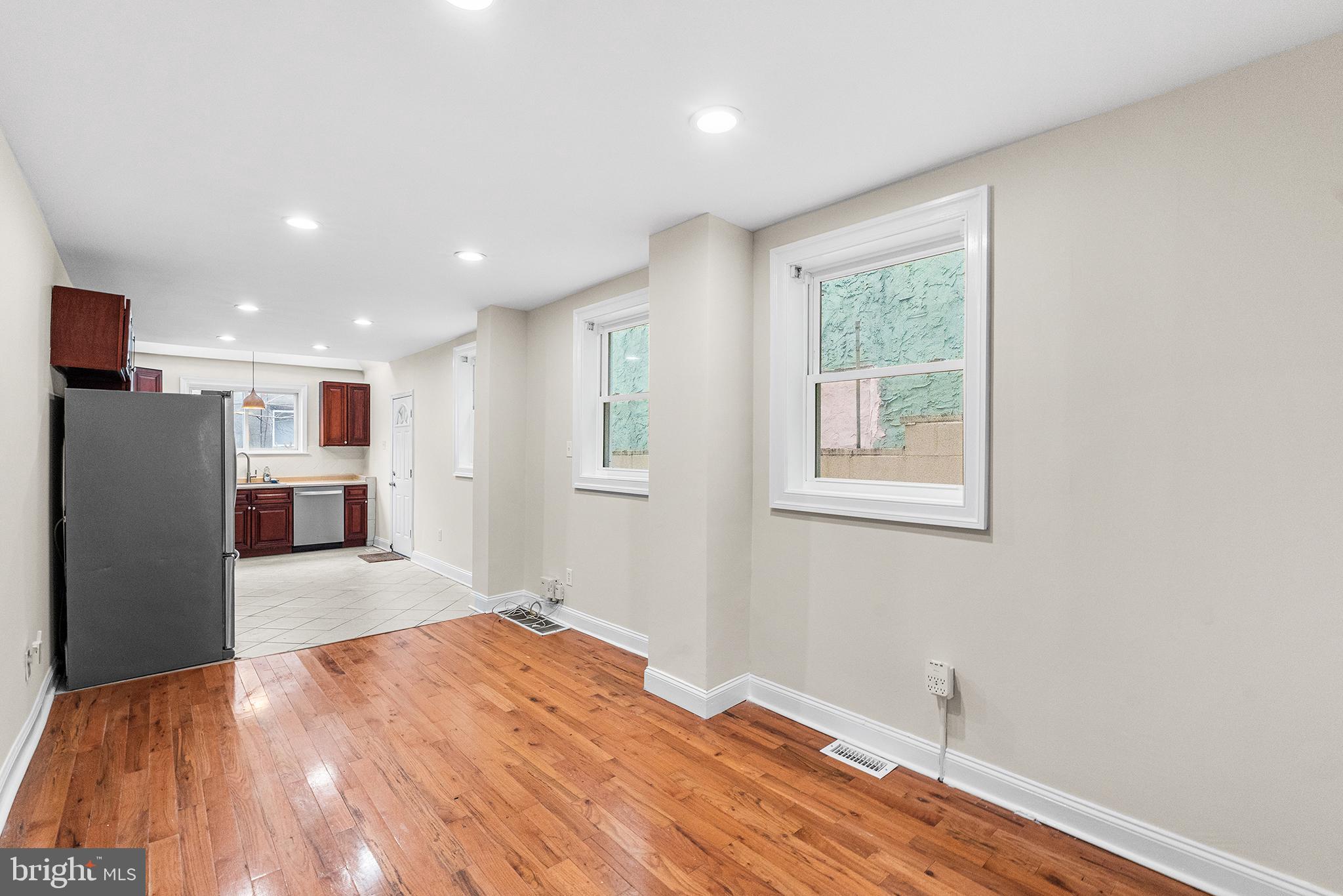 1538 Tasker Street Philadelphia, PA 19145 - Photo 7 of 23 a view of a kitchen with a refrigerator