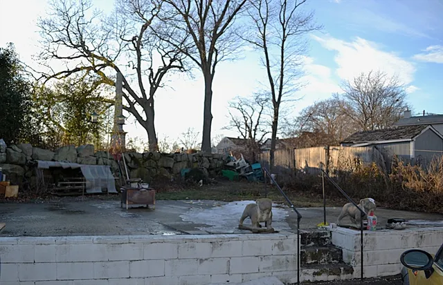 a view of a backyard with sitting area