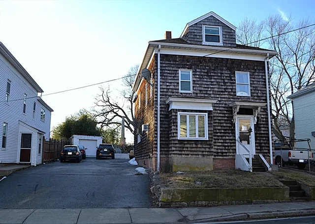 a front view of a house with a yard