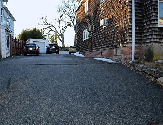 a view of street with parked cars