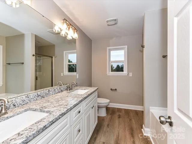 a white bath tub sitting next to a window