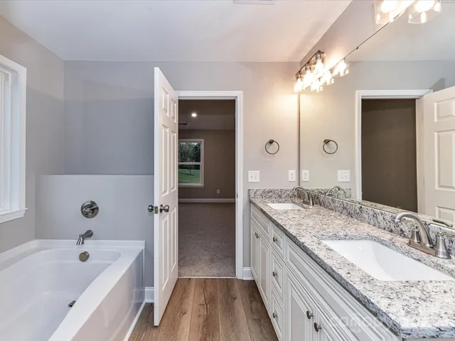 a bathroom with a tub and shower