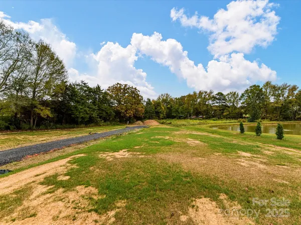 a view of a fountain is middle in the garden
