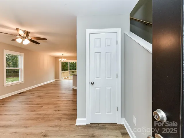 an empty room with windows and closet