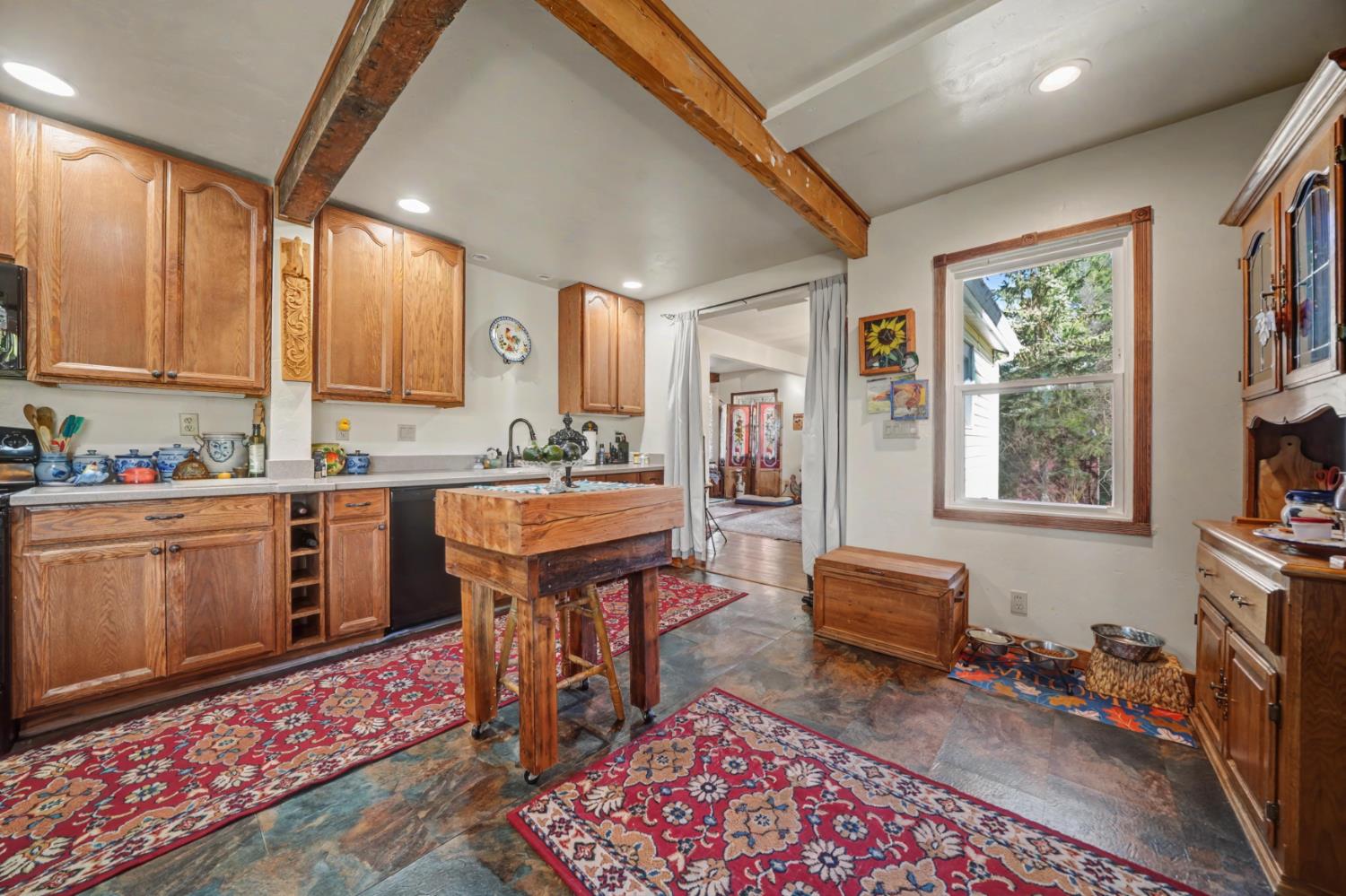 3341 Newtown Road Placerville, CA 95667 - Photo 15 of 49 a open kitchen with stainless steel appliances granite countertop a stove a sink dishwasher and cabinets with wooden floor