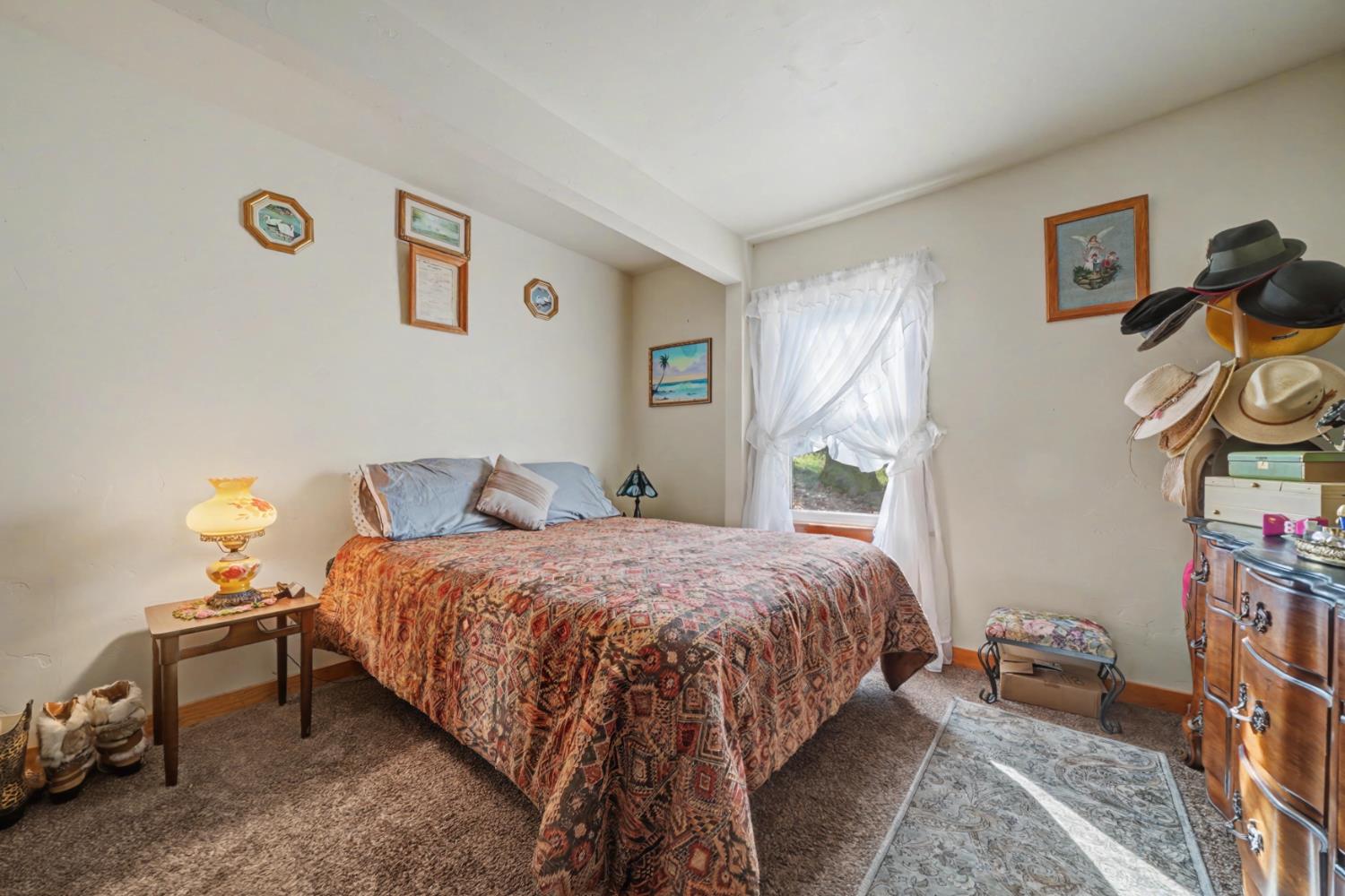 3341 Newtown Road Placerville, CA 95667 - Photo 19 of 49 a bedroom with bed and a window