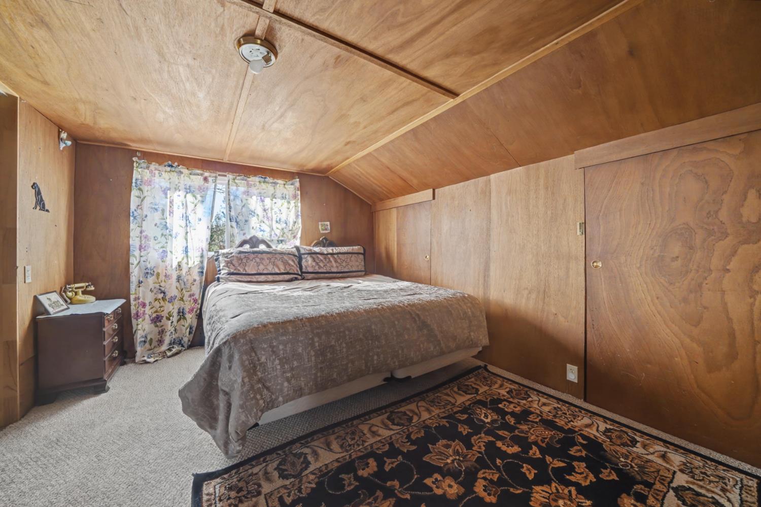 3341 Newtown Road Placerville, CA 95667 - Photo 30 of 49 a bedroom with a bed and a window