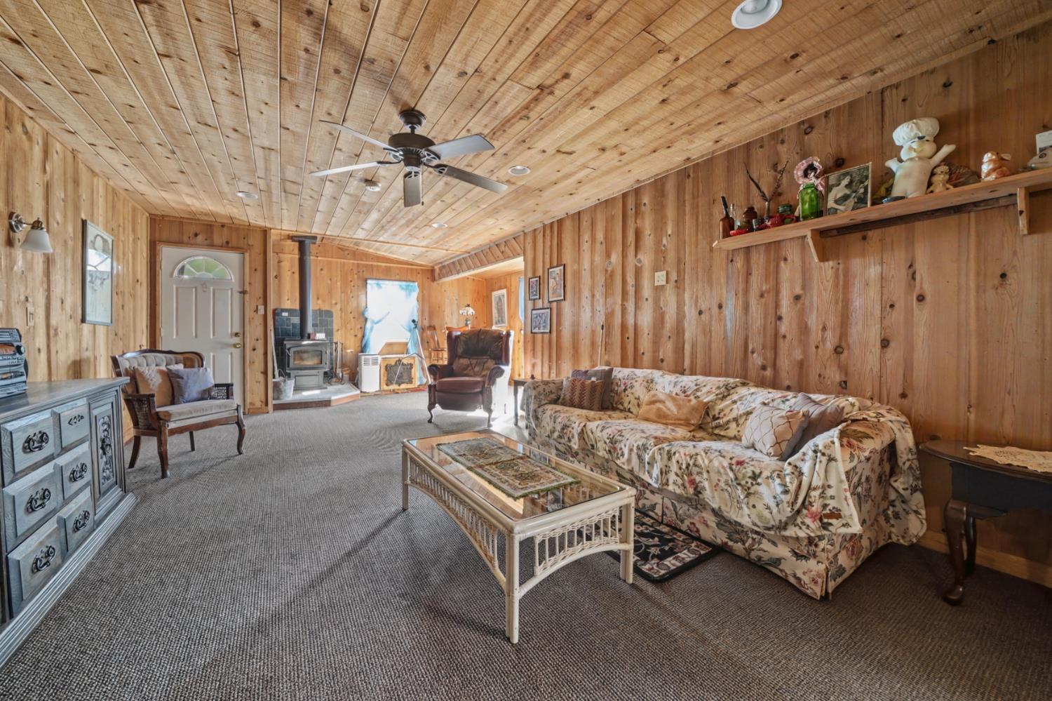 3341 Newtown Road Placerville, CA 95667 - Photo 32 of 49 a living room with furniture and a chandelier