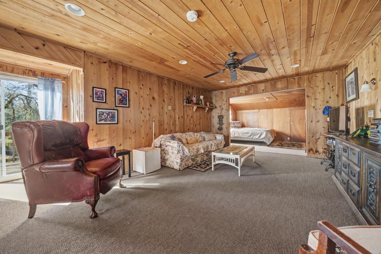 3341 Newtown Road Placerville, CA 95667 - Photo 33 of 49 a living room with furniture gym equipment and a rug
