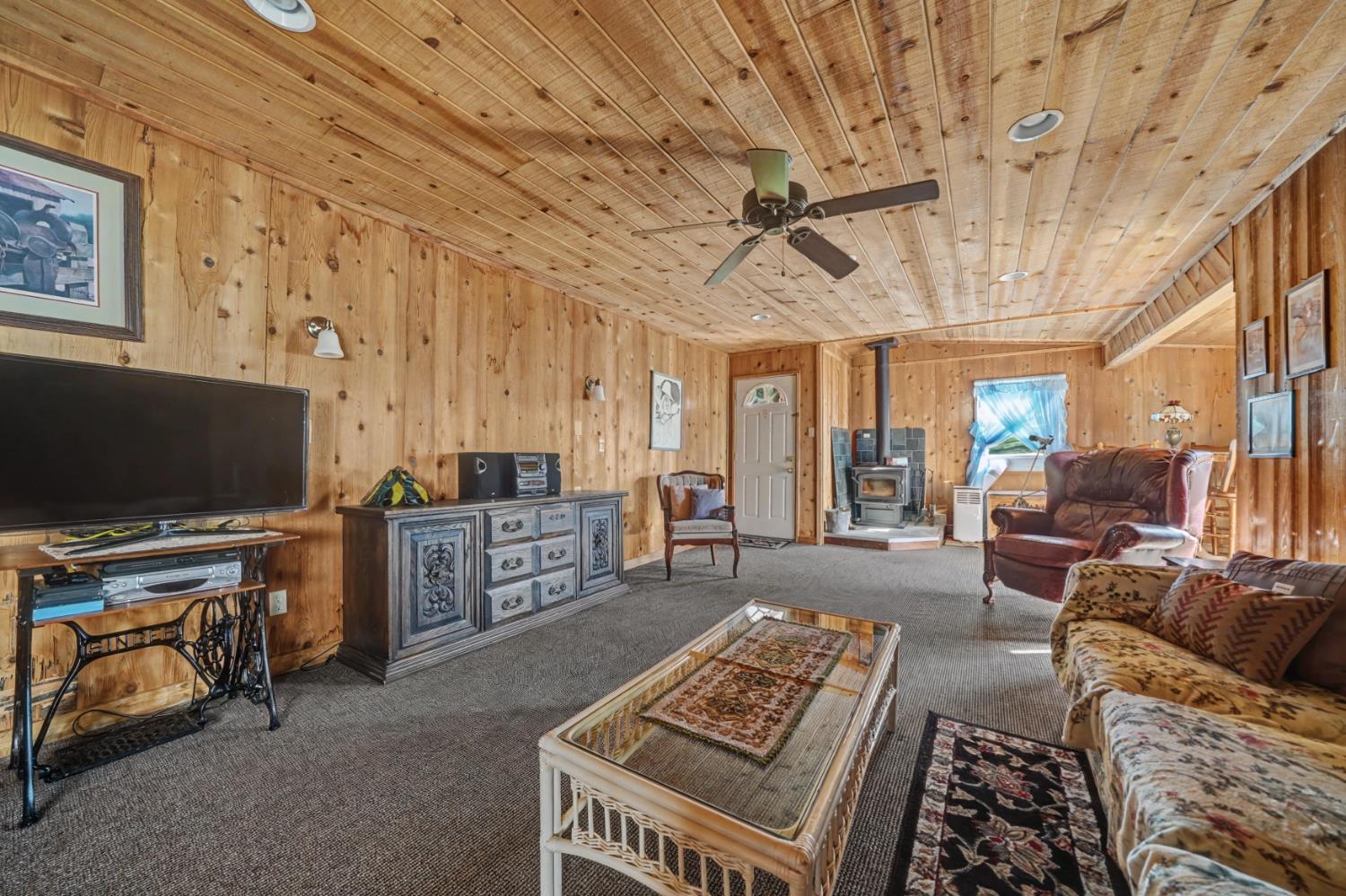 3341 Newtown Road Placerville, CA 95667 - Photo 36 of 49 a living room with furniture and a flat screen tv