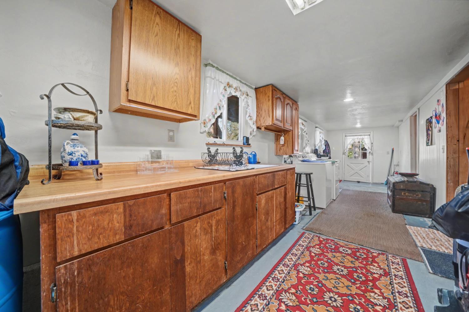 3341 Newtown Road Placerville, CA 95667 - Photo 39 of 49 a hallway with sink and mirror
