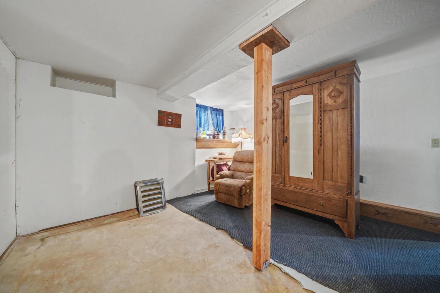 3341 Newtown Road Placerville, CA 95667 - Photo 41 of 49 a bedroom with a bed and a view of en suite bathroom