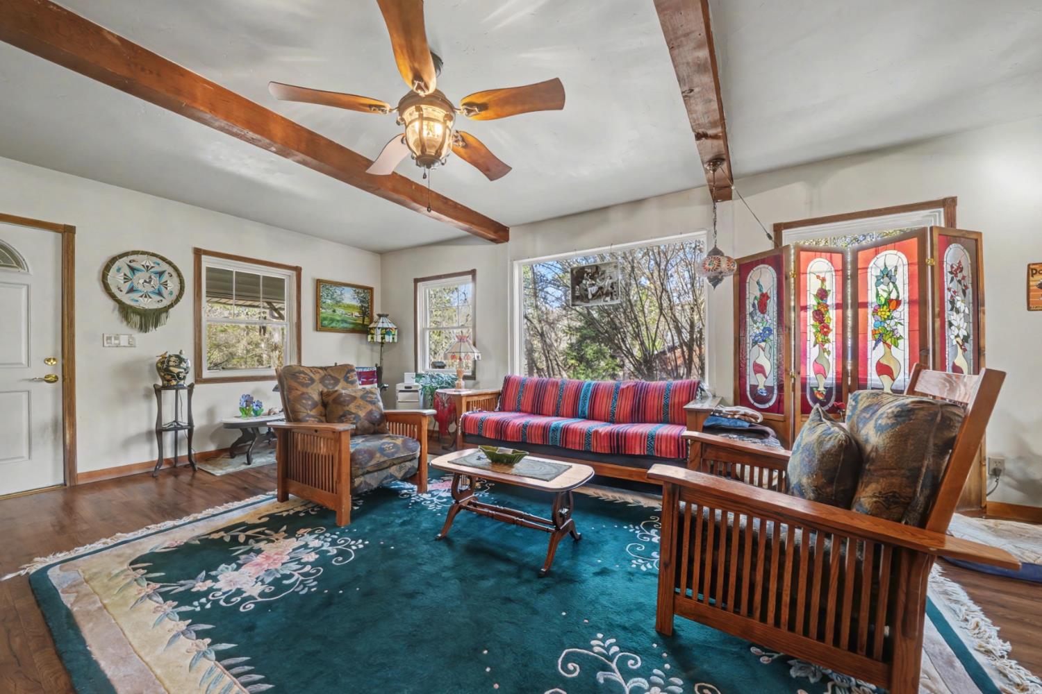 3341 Newtown Road Placerville, CA 95667 - Photo 8 of 49 a living room with furniture ceiling fan and a rug
