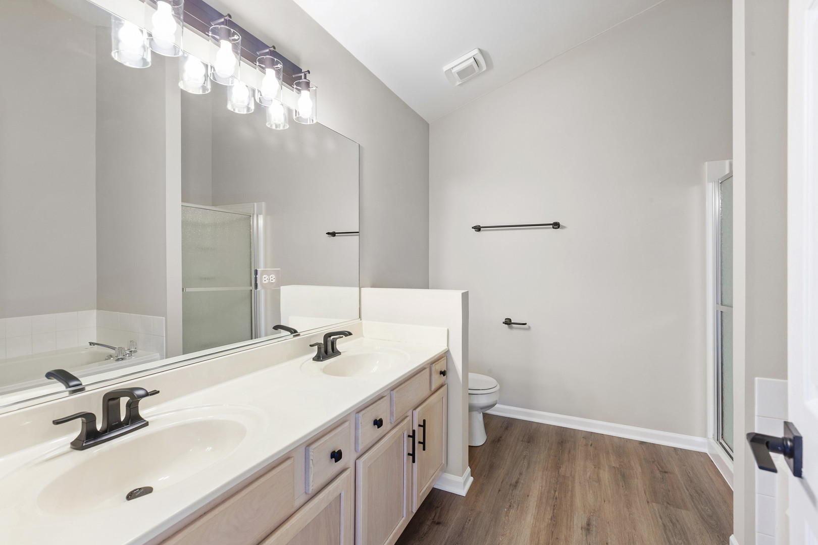 2607 Lexington Lane Naperville, IL 60540 - Photo 17 of 30 a bathroom with a double vanity sink and a mirror