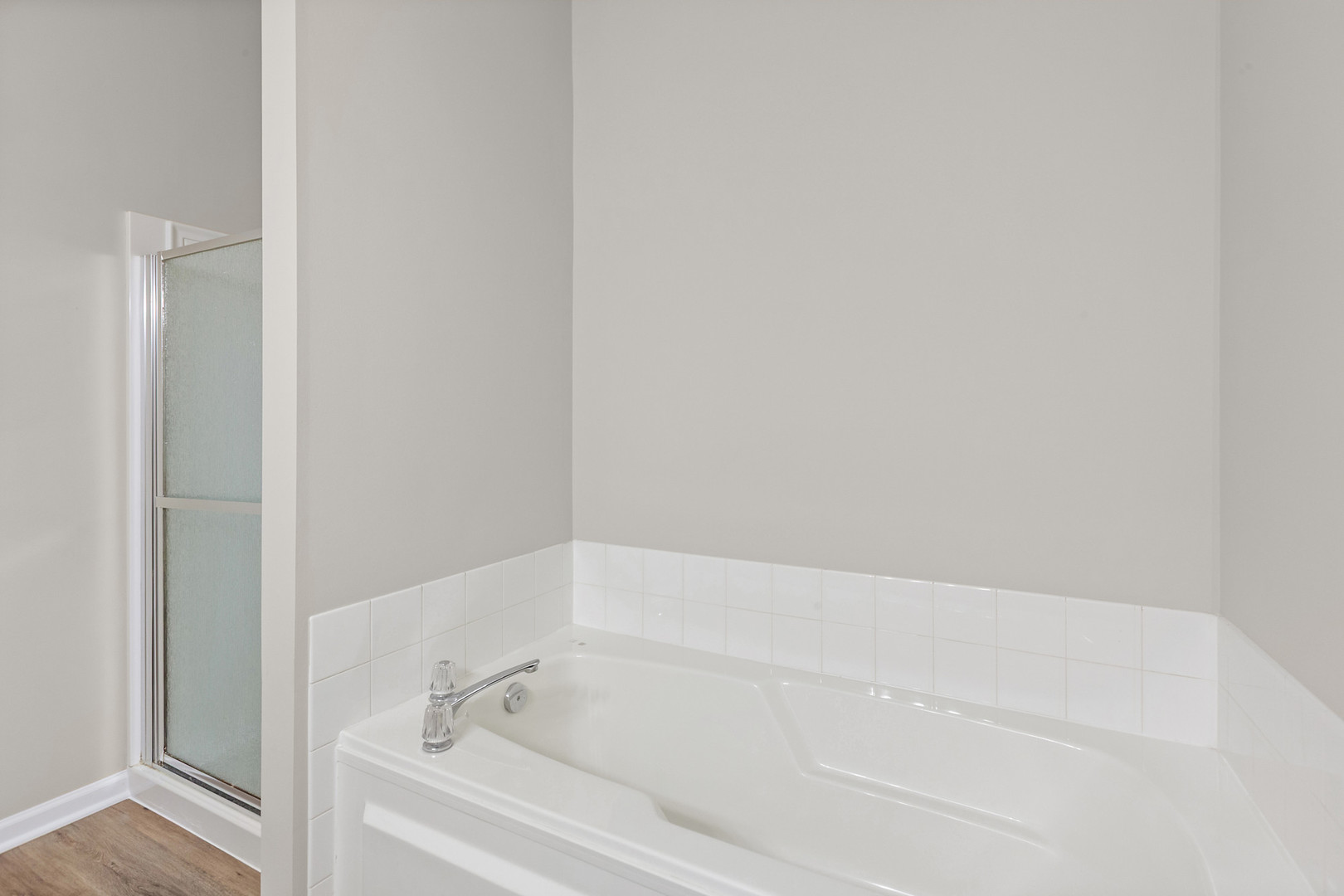 2607 Lexington Lane Naperville, IL 60540 - Photo 18 of 30 a white bath tub and shower in a bathroom