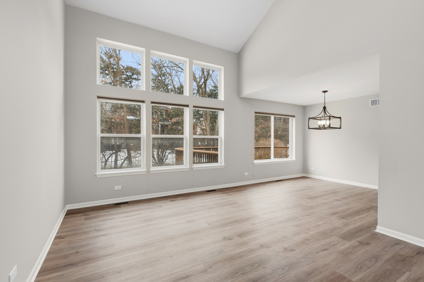 2607 Lexington Lane Naperville, IL 60540 - Photo 2 of 30 an empty room with wooden floor and windows
