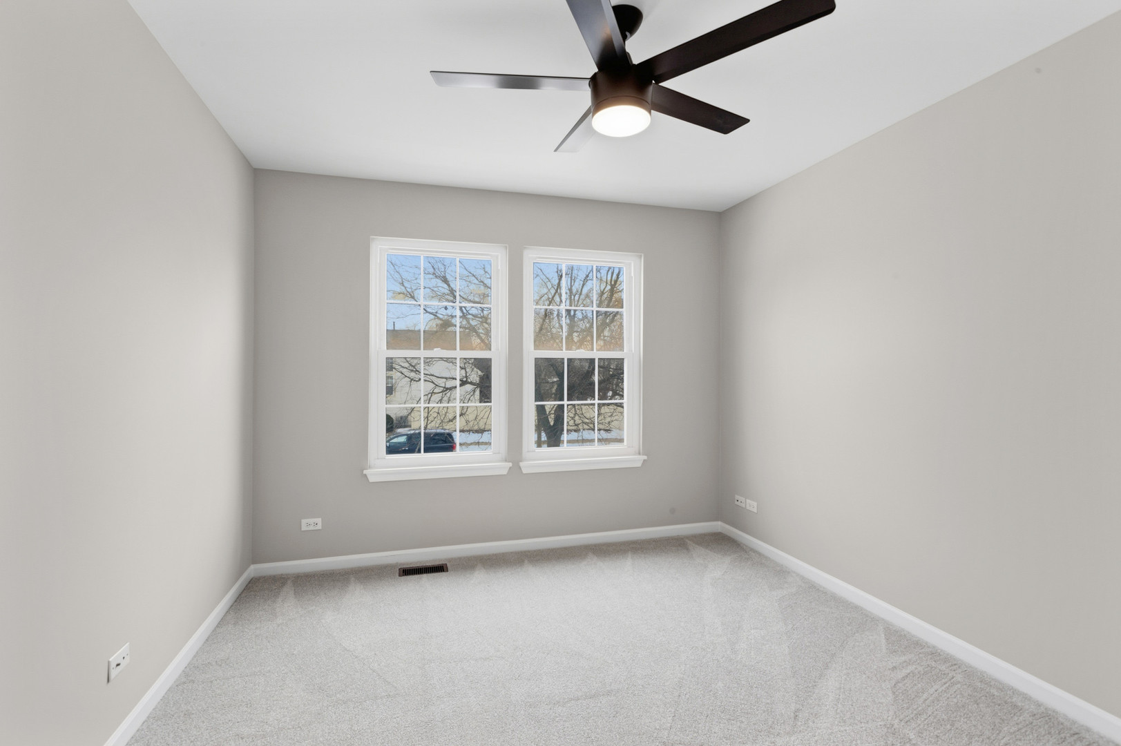 2607 Lexington Lane Naperville, IL 60540 - Photo 24 of 30 an empty room with a window and a fan