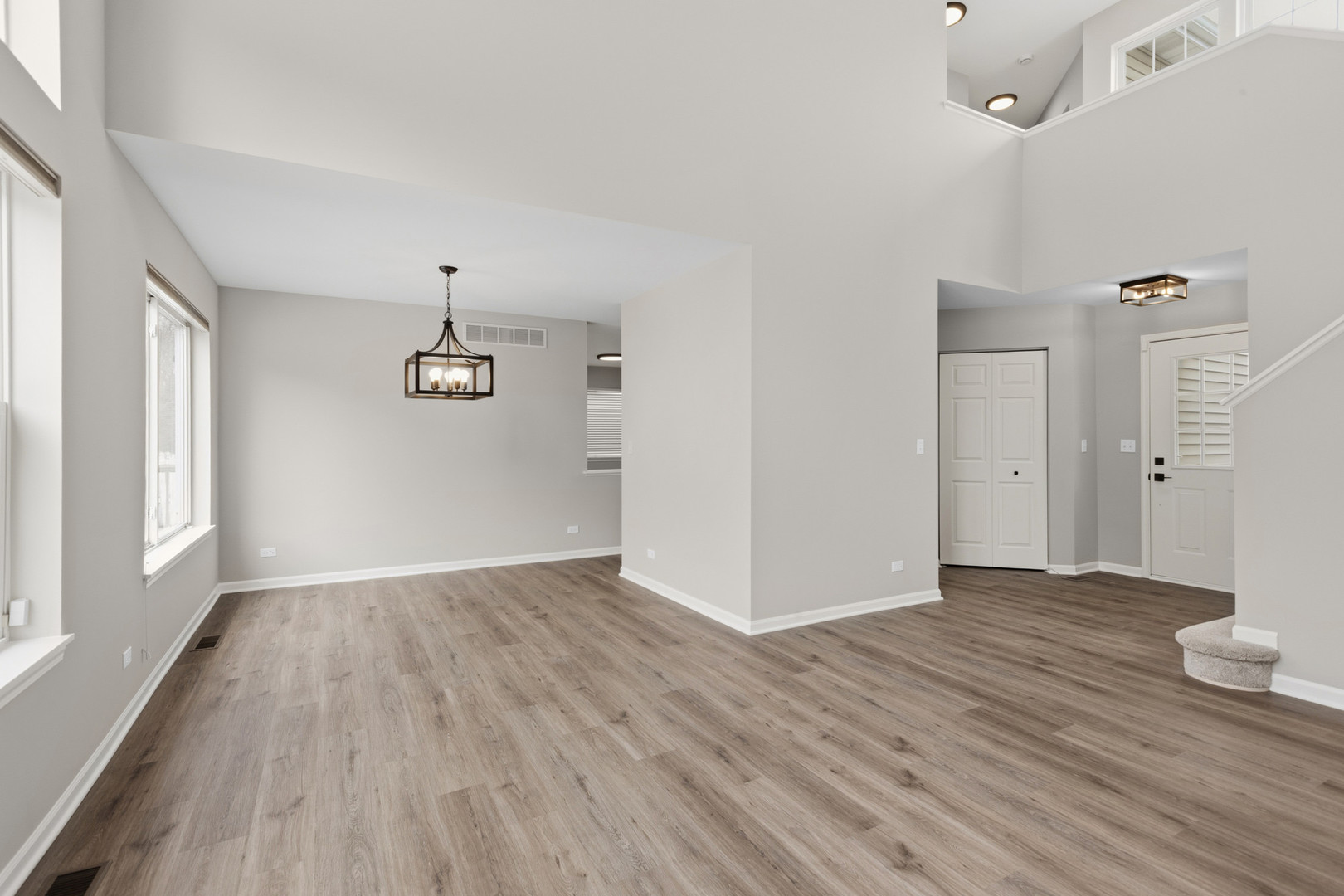 2607 Lexington Lane Naperville, IL 60540 - Photo 4 of 30 an empty room with wooden floor and windows