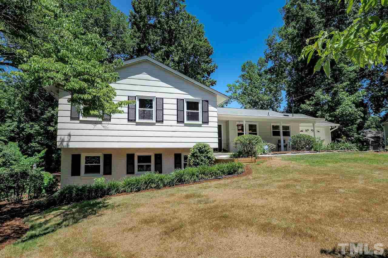 1113 Winona Road Raleigh, NC 27609 - Photo 12 of 25 a front view of a house with a garden