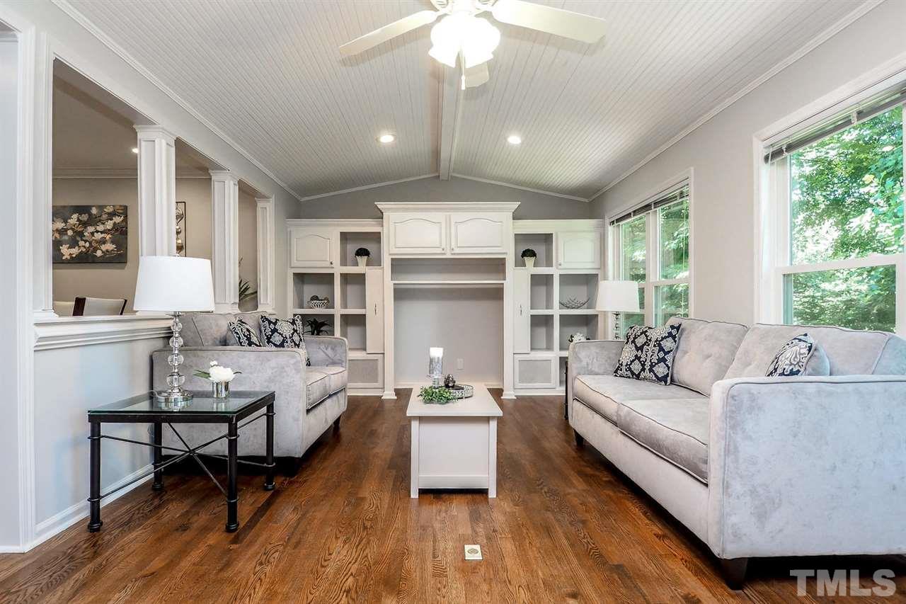 1113 Winona Road Raleigh, NC 27609 - Photo 14 of 25 a living room with furniture and a large window