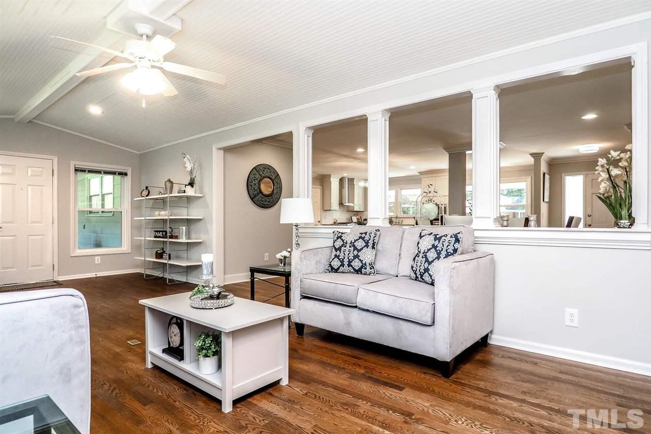 1113 Winona Road Raleigh, NC 27609 - Photo 15 of 25 a living room with furniture and a large window
