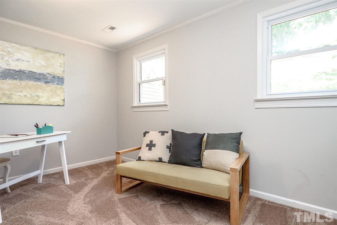 1113 Winona Road Raleigh, NC 27609 - Photo 24 of 25 a living room with furniture and a window