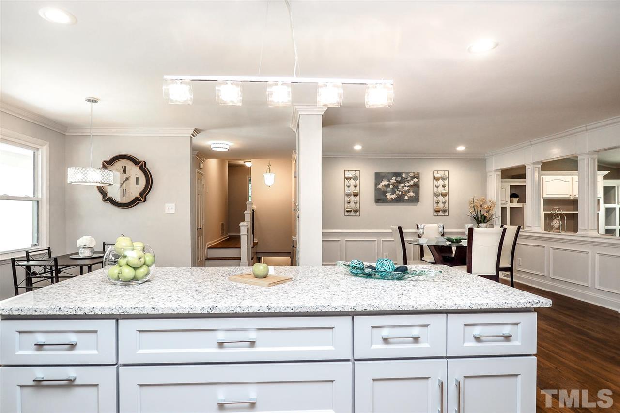 1113 Winona Road Raleigh, NC 27609 - Photo 5 of 25 a bathroom with a granite countertop sink and a mirror