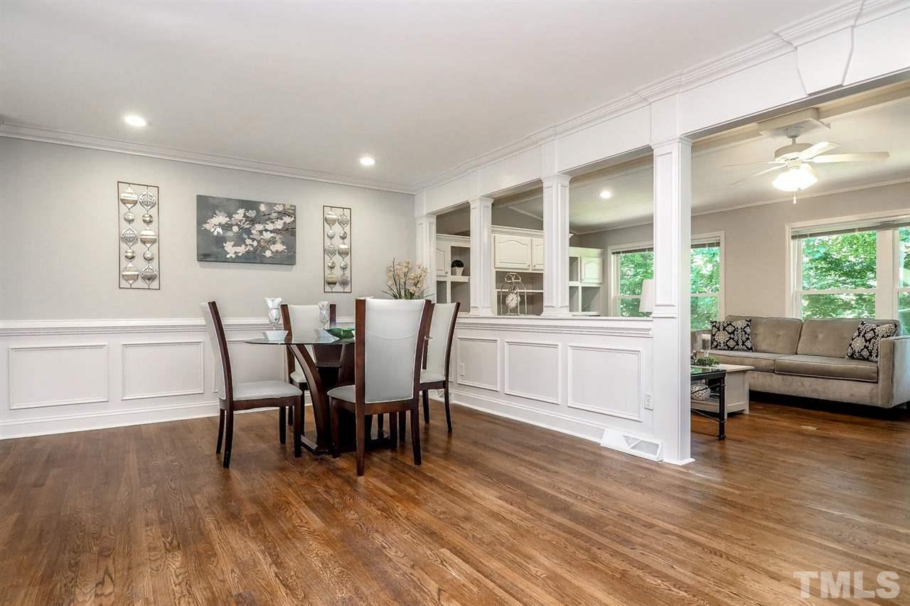 1113 Winona Road Raleigh, NC 27609 - Photo 9 of 25 a view of a dining room with furniture and wooden floor