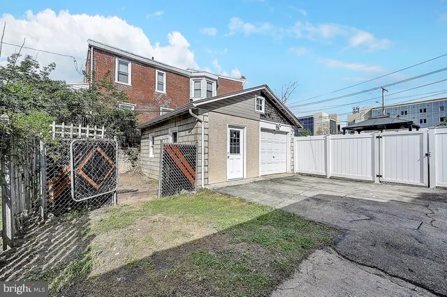 a view of a house with a yard and garage