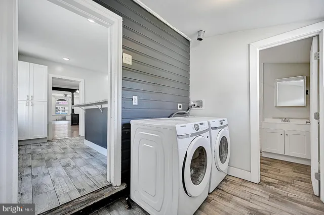 a bathroom with a shower a toilet and sink